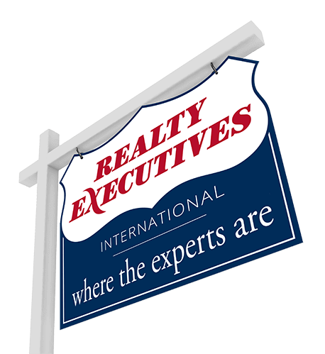a real estate property sign displaying the Realty Executives logo and slogan where the experts are